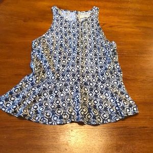 Blue and white sleeveless peplum top.